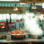 Steaming tteokbokki and Korean street food displayed at a traditional food stall in Korea